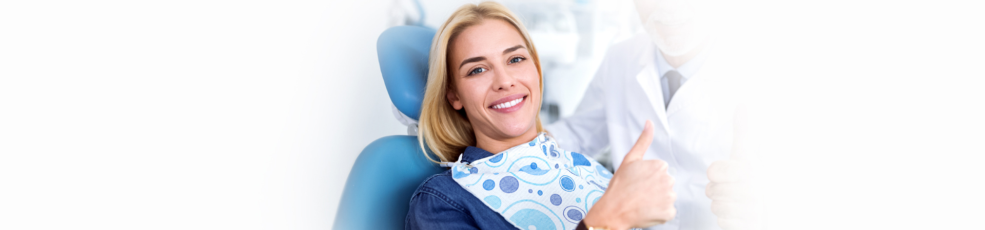 Girl happy and showing thumb up for her root canal treatment in Whitby, ON.